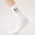 White Pilates grip socks with puppy embroidery and heart-shaped non-slip grips