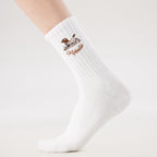 White Pilates grip socks with puppy embroidery and heart-shaped non-slip grips