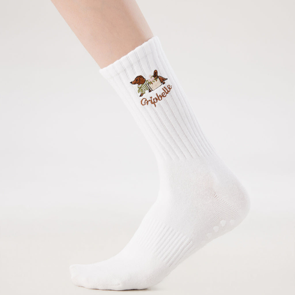 White Pilates grip socks with puppy embroidery and heart-shaped non-slip grips