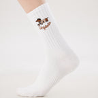 White Pilates grip socks with puppy embroidery and heart-shaped non-slip grips