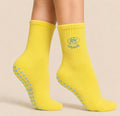 Yellow Pilates grip socks with heart-shaped non-slip grips for Reformer Pilates and studio workouts for Reformer Pilates