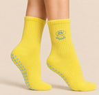 Yellow Pilates grip socks with heart-shaped non-slip grips for Reformer Pilates and studio workouts for Reformer Pilates