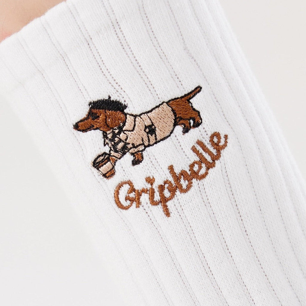 Close up of the dachshund embroidery on Gripbelle Coffee Run Puppy pilates grip socks