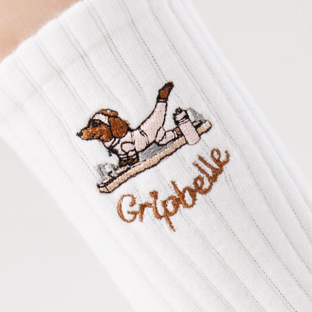 Close up of the dachshund embroidery on Gripbelle Pilates Morning Puppy pilates grip socks