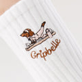 Close up of the dachshund embroidery on Gripbelle Pilates Morning Puppy pilates grip socks