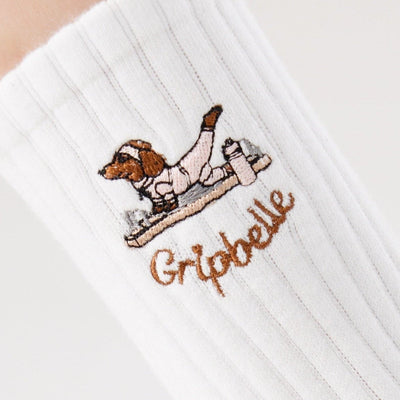 Close up of the dachshund embroidery on Gripbelle Pilates Morning Puppy pilates grip socks