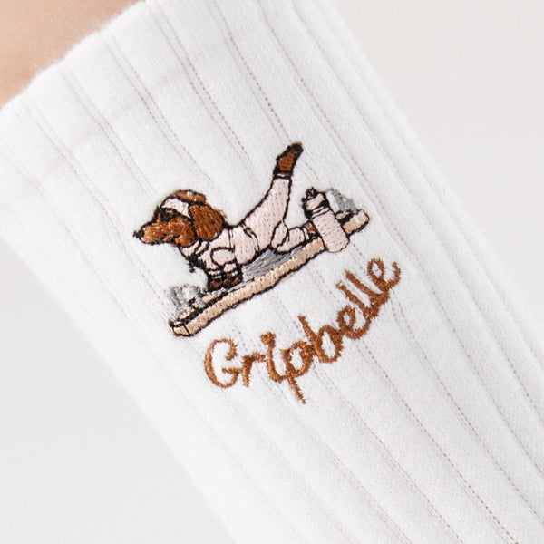Close up of the dachshund embroidery on Gripbelle Pilates Morning Puppy pilates grip socks