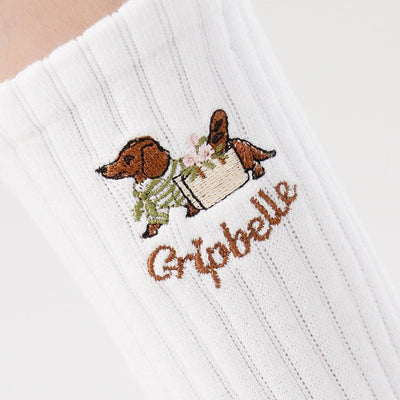 Close up of the dachshund embroidery on Gripbelle Weekend Stroll Puppy pilates grip socks